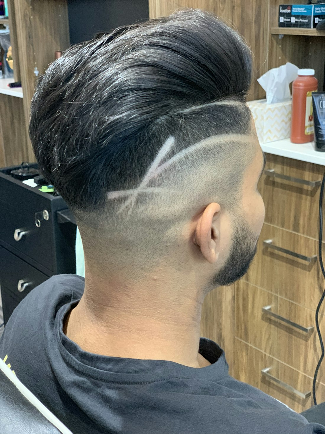 The back of a freshly finished fade, clean lines worked into the taper